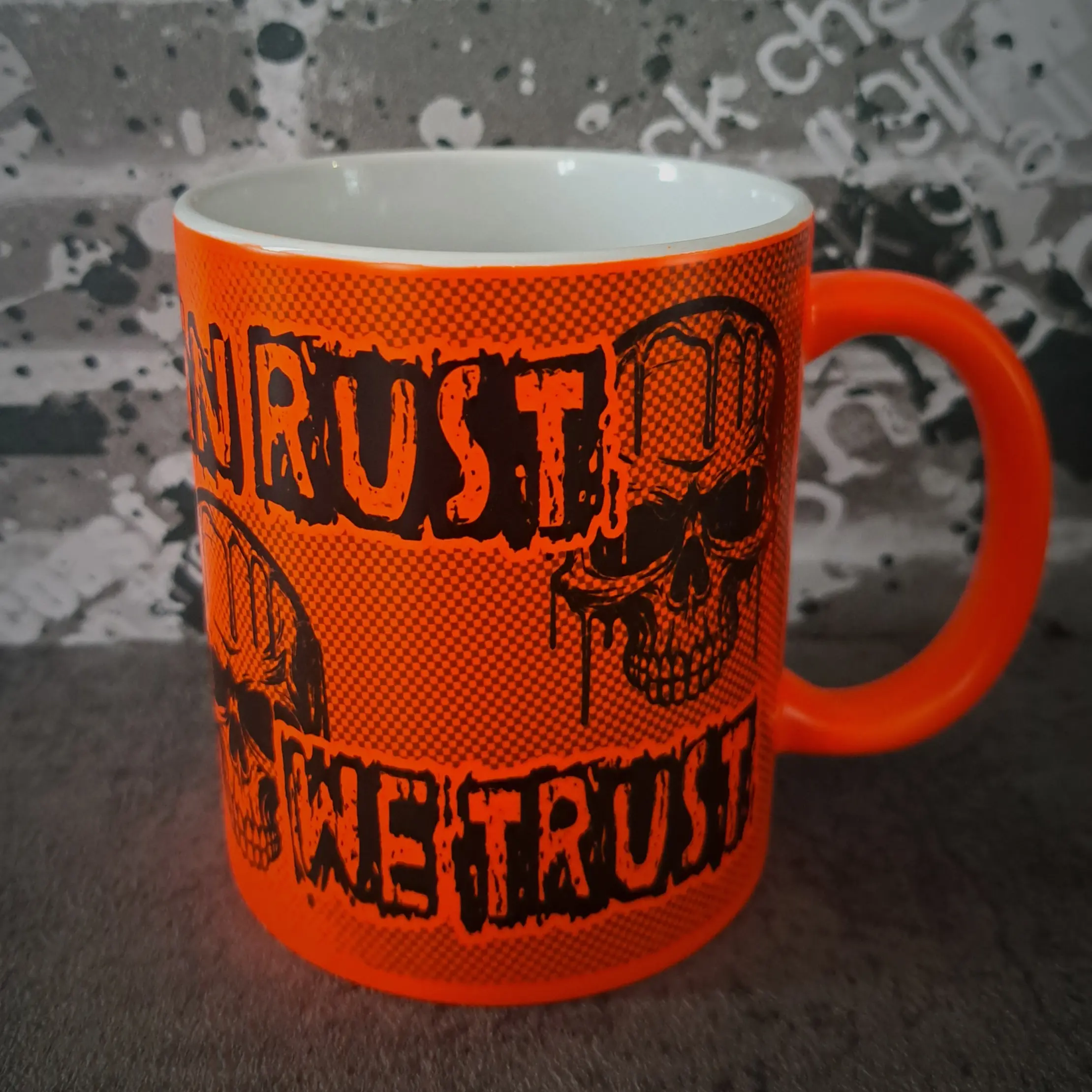 In Rust we Trust Mug - Fluorescent Orange Skull Mug 2 Left angle view of fluorescent orange skull mug showing In Rust We Trust lettering for petrol head gifts