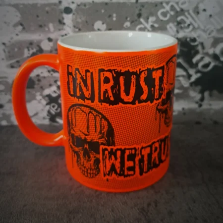 In Rust We Trust mug in fluorescent orange with dripping skull graphic and matching orange handle