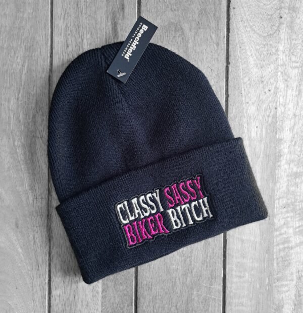 Black embroidered beanie with pink and white “Classy Sassy Biker Bitch” text
