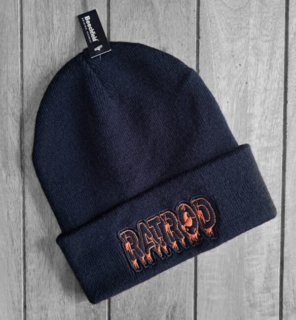 Black knit beanie with orange embroidered RATROD lettering