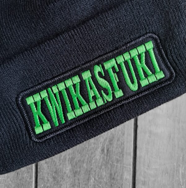 Close-up of Kwikasfuki embroidery on biker beanie