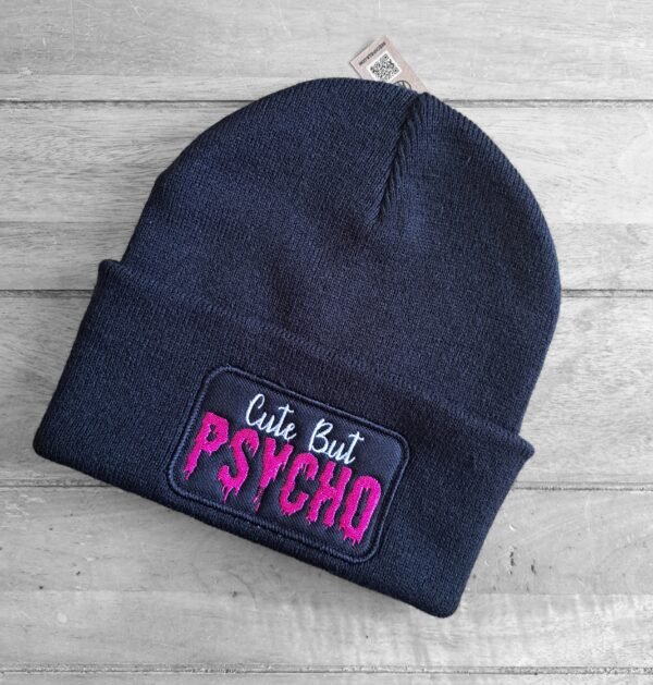 Close-up of Cute But Psycho patch on biker beanie