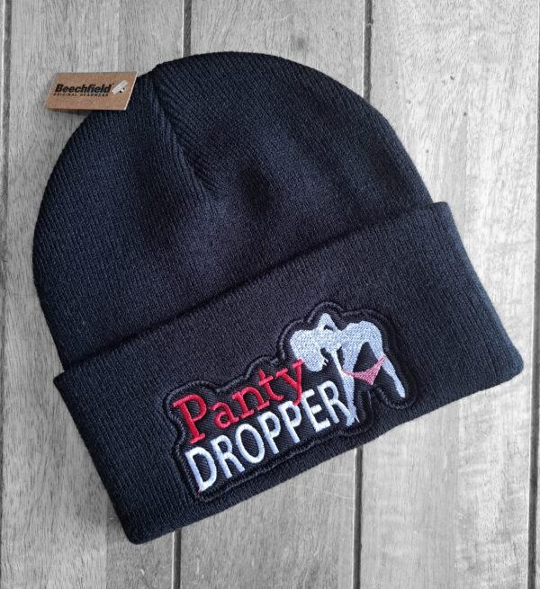 Panty Dropper embroidered biker beanie on wood background