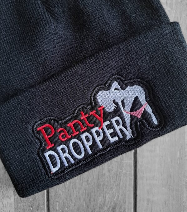 Close-up of Panty Dropper embroidered patch on biker beanie