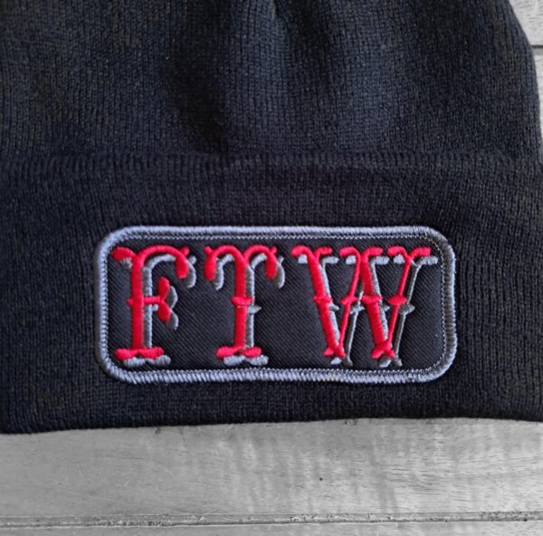 Close-up of FTW embroidery on biker beanie