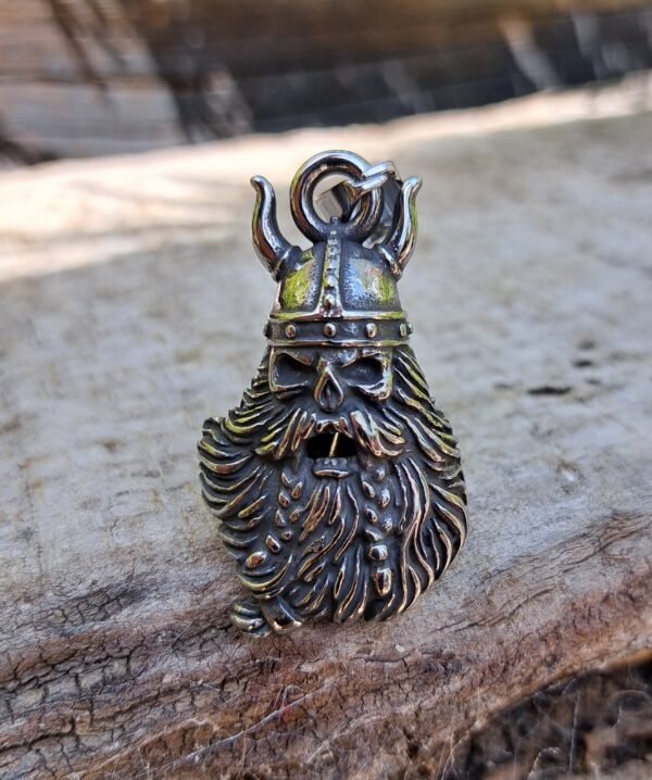 Front view of a stainless steel Viking gremlin bell for motorcycles with horned helmet design