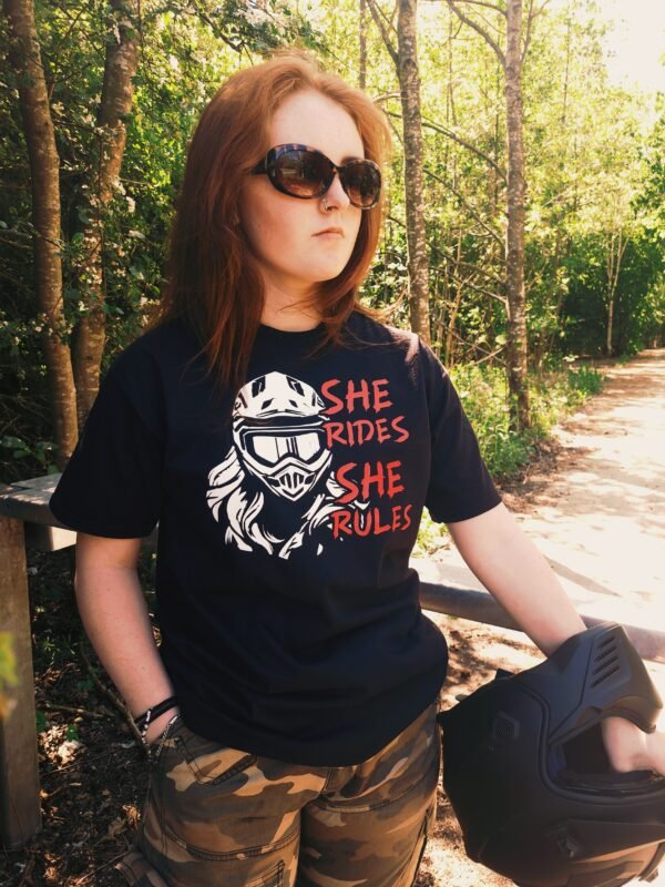 Front view of women’s motorcycle t-shirt with bold red and white helmet graphic