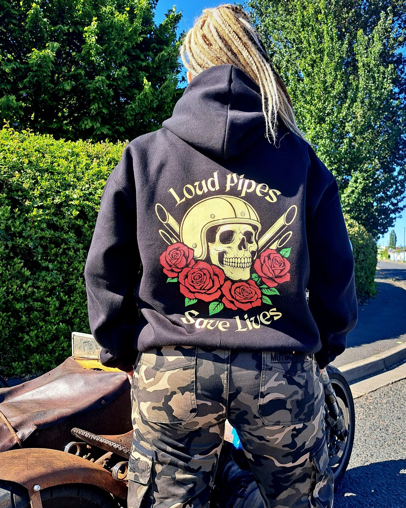 Close-up of Loud Pipes Save Lives skull and roses graphic on back of RatRyder ladies motorcycle hoodie