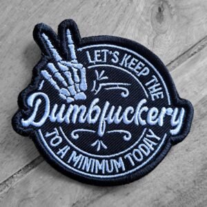 Humorous embroidered patch with bold text: "Let’s Keep the Dumbfuckery to a Minimum Today" and a skeleton peace hand.
