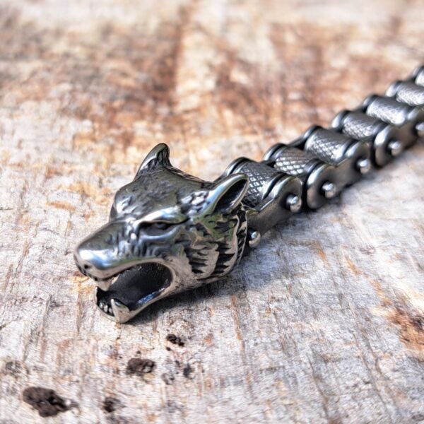 Close-up of stainless steel Fenrir wolf head biker chain bracelet