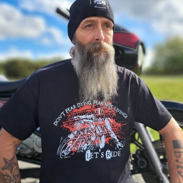 Close view of the “Don’t Fear Dying, Fear Not Living! Let’s Ride” print showing detailed motorcycle artwork and red splatter effect on black tee.