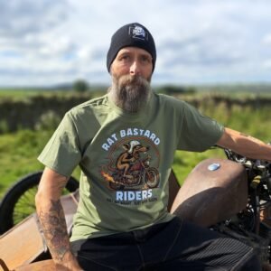 Olive green Rat Bastard Riders t-shirt by Rat-Ryder with hot-rod rat motorcycle graphic and “Built Not Bought, Rust Never Sleeps” slogan.