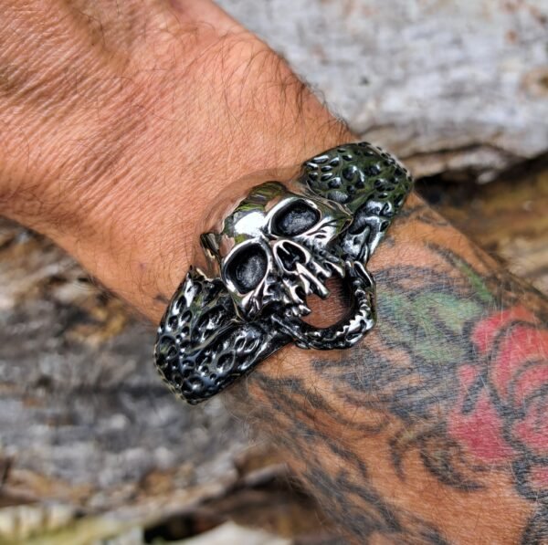 Rat-Ryder stainless steel skull bracelet worn on wrist with tattoo, gothic biker style