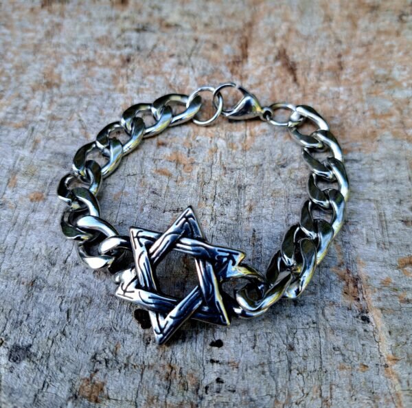 Pagan stainless steel bracelet with interwoven star design on rustic wood