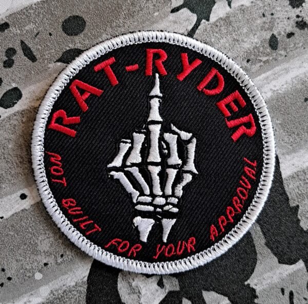 RAT-RYDER embroidered patch with a white skeleton hand flipping the middle finger and red text that says ‘Not built for your approval’ on a black background