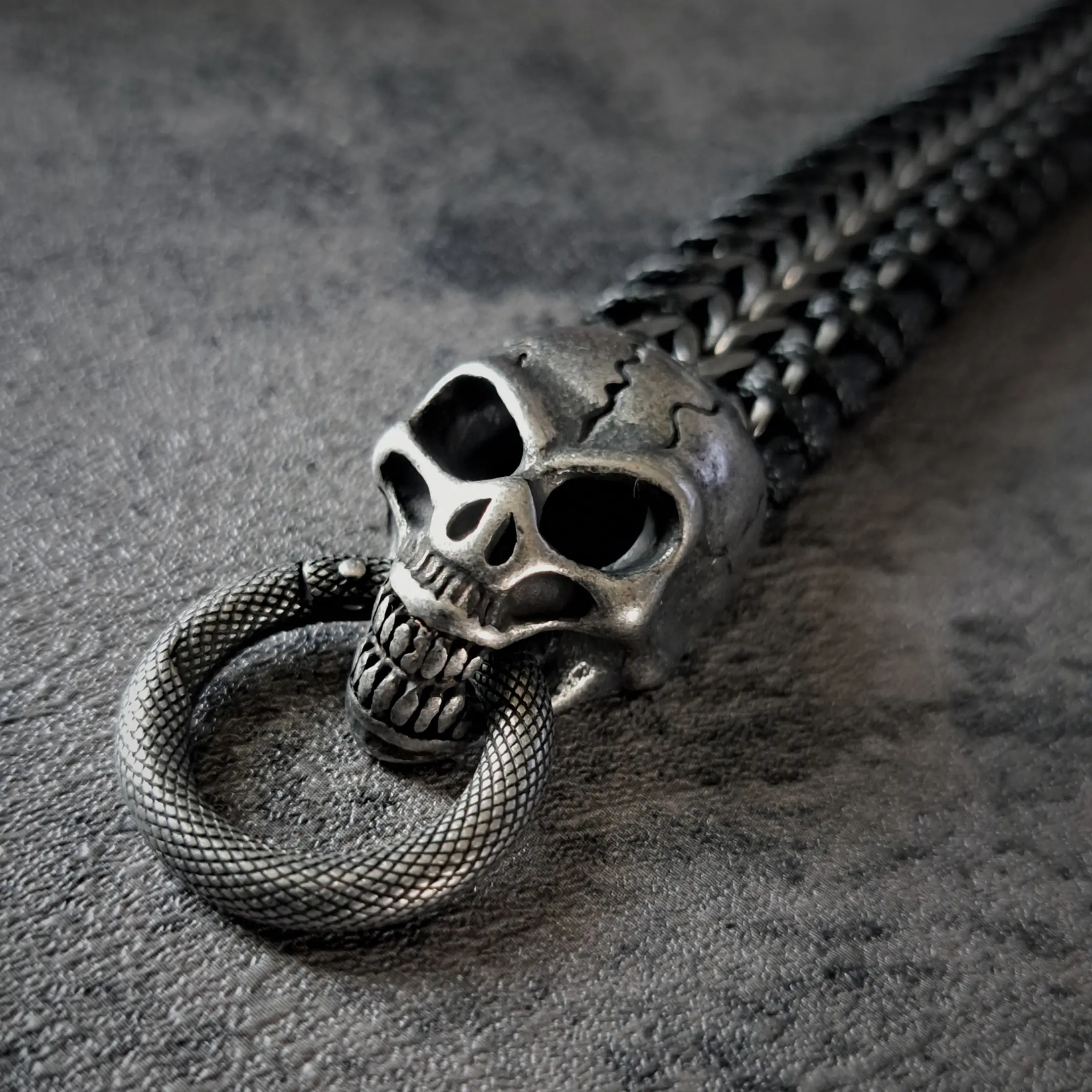 Men's Heavy Stainless Steel Skull and Leather Bracelet | 95g, 20mm Snap Ring 5 Textured serpent snap ring closure on mens outlaw biker bracelets