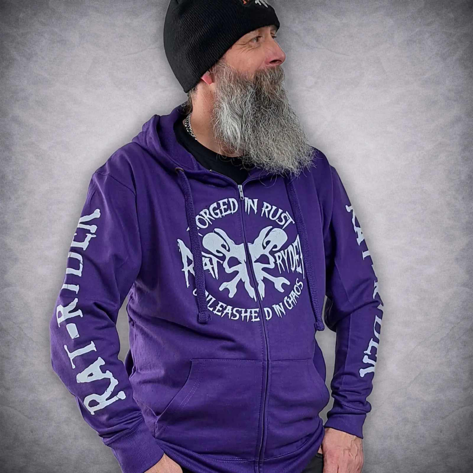 Rat-Ryder Purple Zip Up Biker Hoodie - Forged in Rust Edition 1 Model wearing Rat-Ryder purple zip up biker hoodie zipped up with white Forged in Rust skull graphic on the front chest.