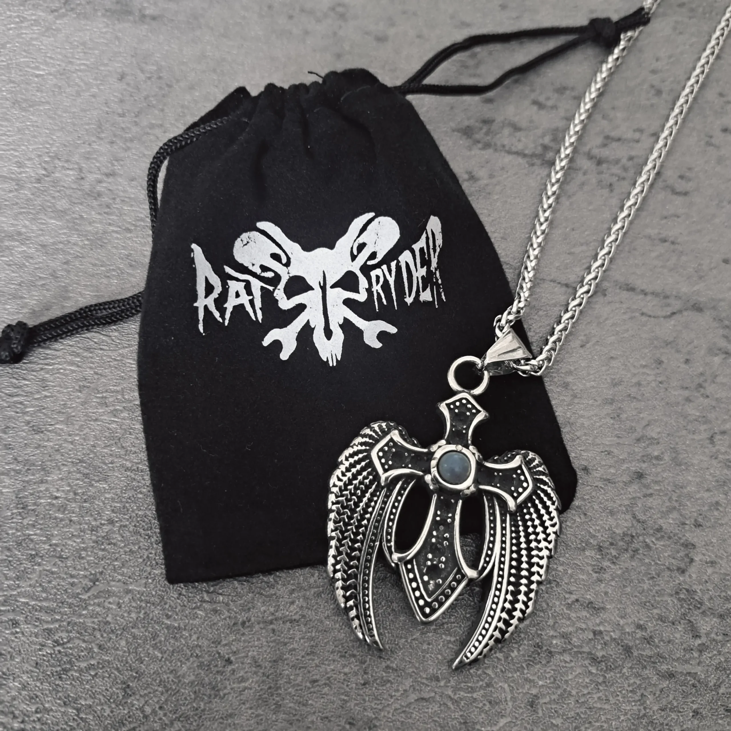Dark Wing Turquoise Cross – Solid 316L Stainless Steel Biker Pendant | RatRyder 3 Solid 316L stainless steel dark wing turquoise cross biker pendant on black RatRyder gift pouch