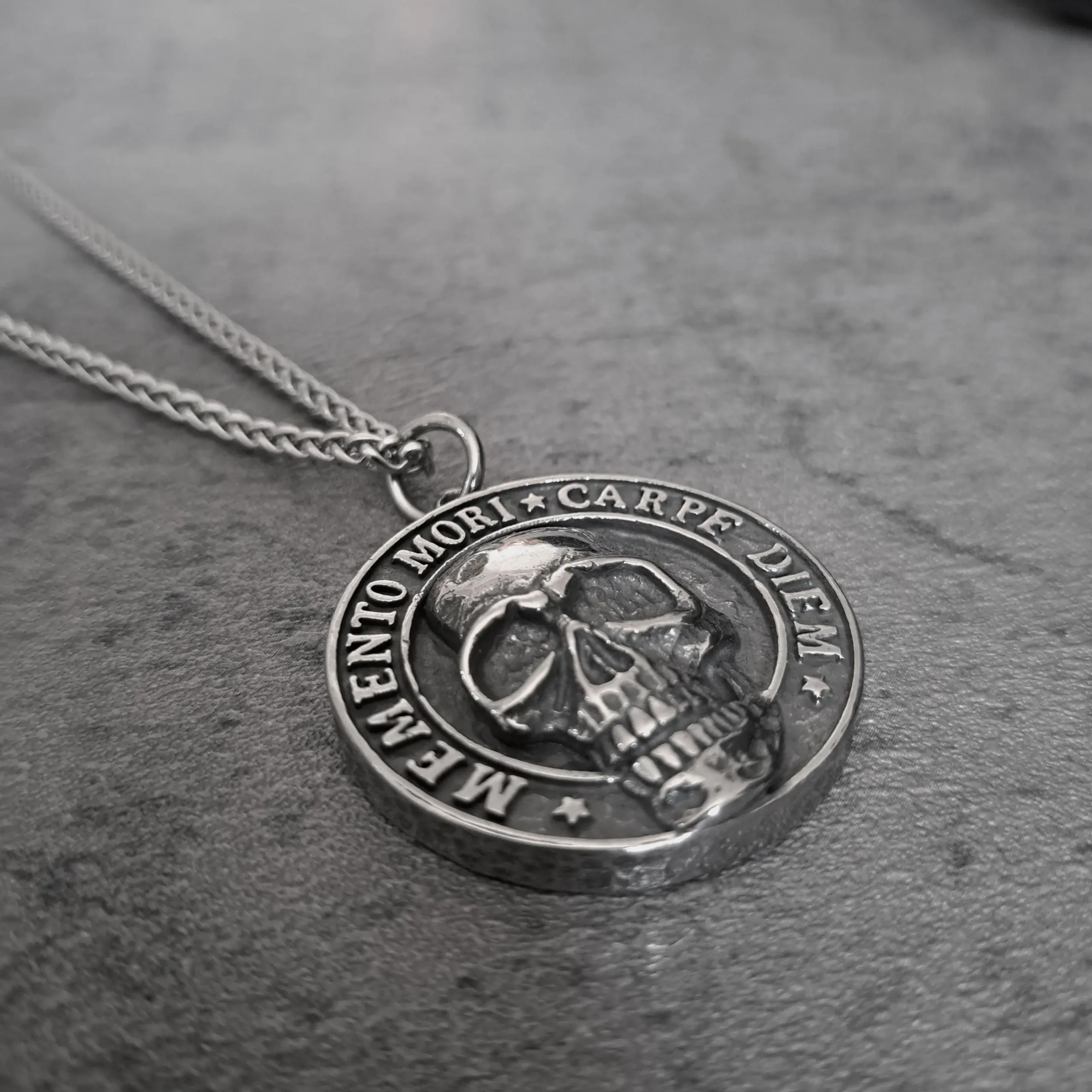 Memento Mori Carpe Diem Skull – 316L Stainless Steel Biker Pendant | RatRyder 2 Angled view of Memento Mori Carpe Diem skull stainless steel biker pendant