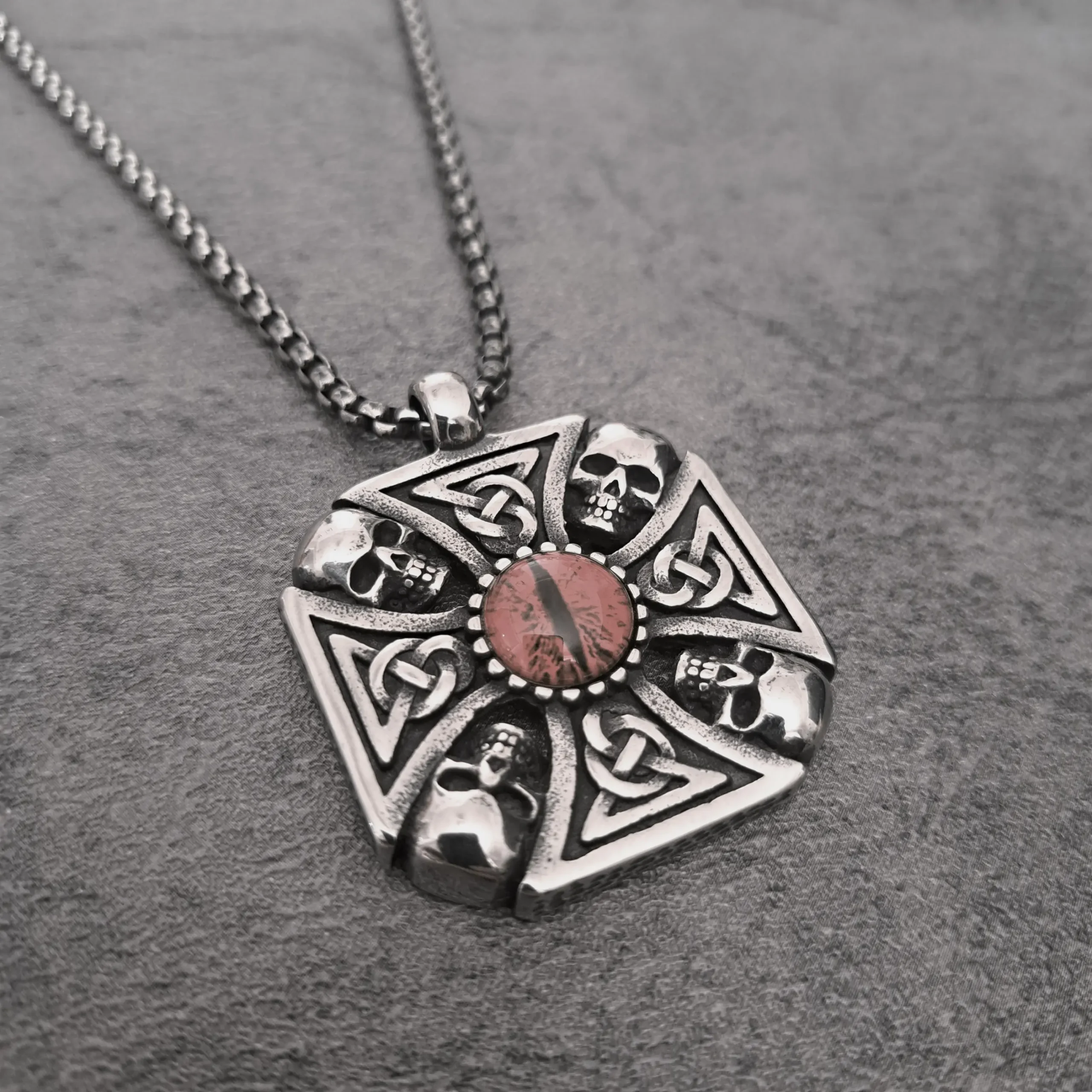 Red Dragon Eye Skull Celtic Cross – 316L Stainless Steel Biker Pendant | RatRyder 2 Angled view of red dragon eye skull Celtic cross stainless steel biker pendant