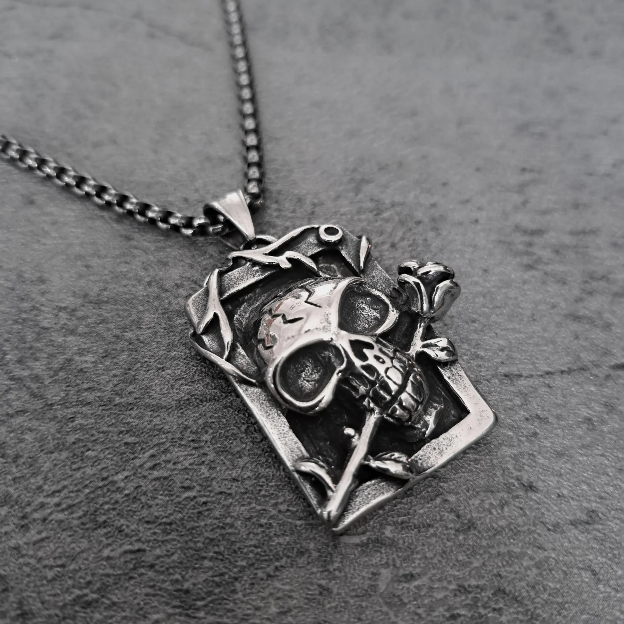 Skull & Rose Tarot Card – 316L Stainless Steel Biker Pendant | RatRyder 2 Angled view of skull and rose tarot card stainless steel biker pendant