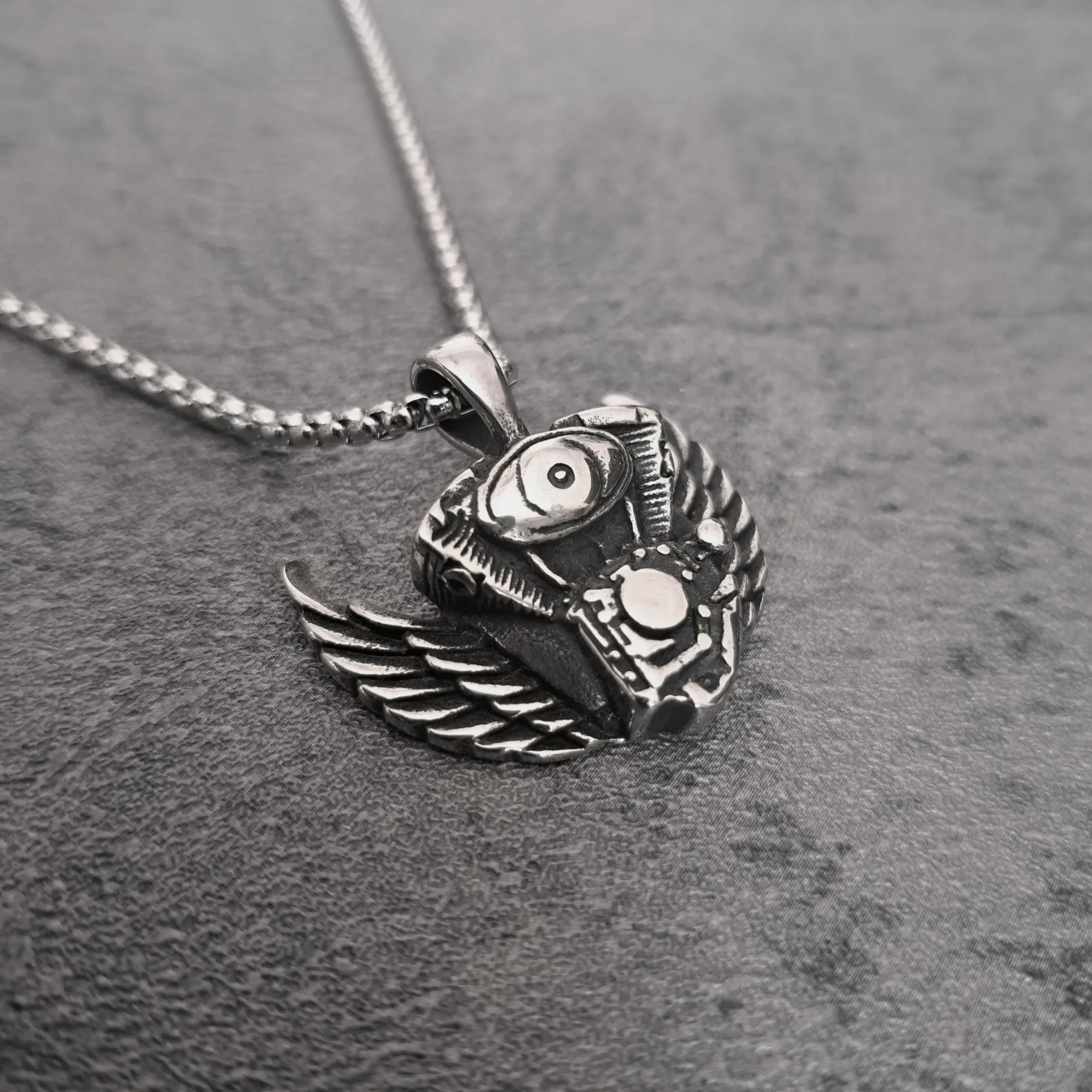 Winged V-Twin Engine – 316L Stainless Steel Harley Biker Pendant | RatRyder 2 Angled view of winged Harley V-twin engine stainless steel biker pendant