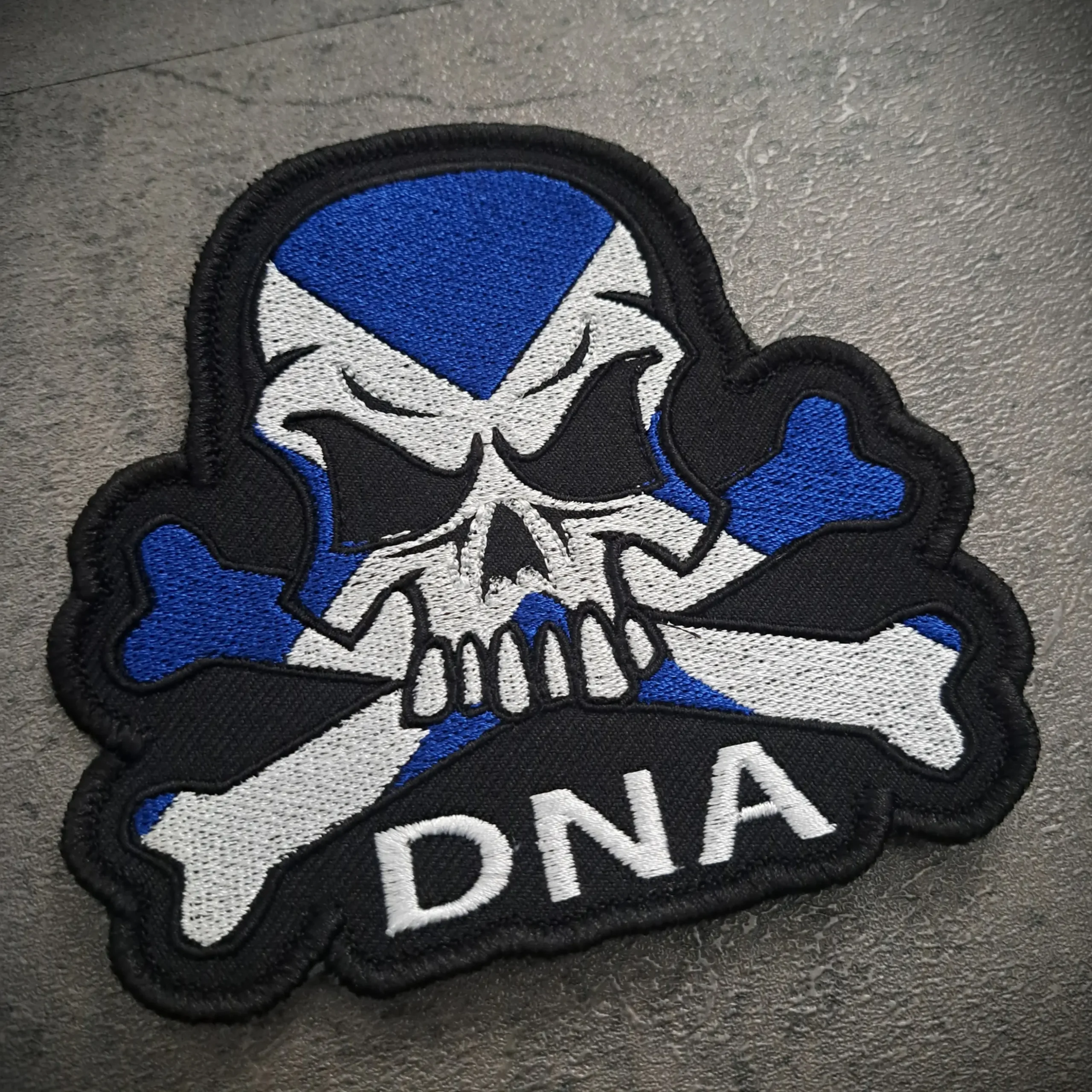 Scotland Flag Skull Embroidered Biker Patch – Sew On | Rat-Ryder 2 Angled view of Scottish skull embroidered biker patch showing stitched detail